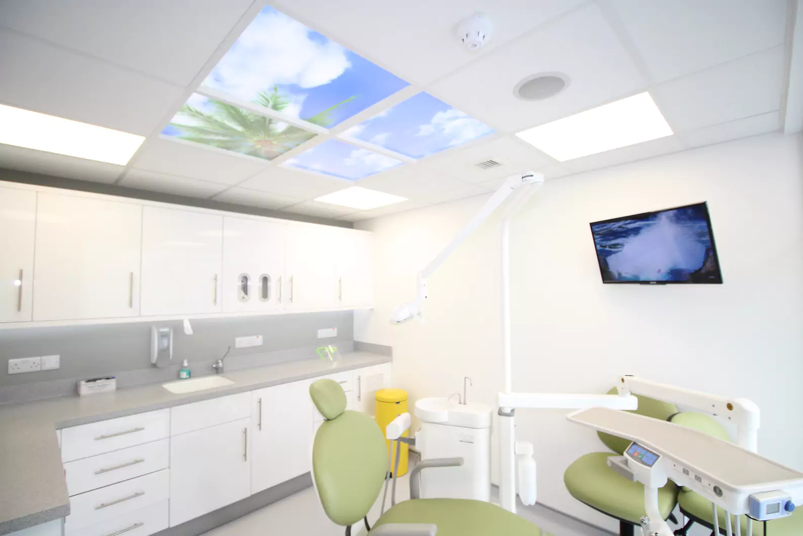 Dental office surgery with modern equipment inside a medical healthcare dental clinic, with white interior walls, modern dentist chair, regulation compliant layout, 5-surgery dental clinic in Ireland.